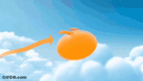 Orange Balloon Flying Through Blue Sky With Clouds GIF