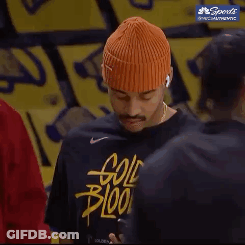 Orange Beanie And Black Shirt Man On Phone GIF