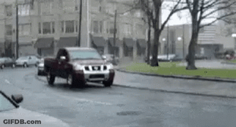 Orange Hellcat Drifting Beside Moving Cars GIF