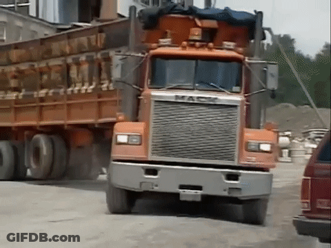 Orange Mack Truck Driving GIF