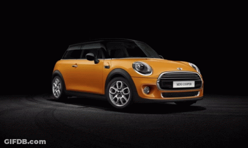 Orange Mini Cooper Parked On Black Background GIF