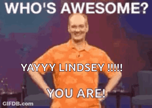 Orange Shirt Man Hands On Hips Saying Who's Awesome GIF