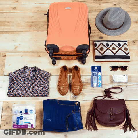 Orange Suitcase Surrounded By Shoes And Hat GIF