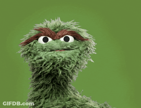 Oscar The Grouch From Sesame Street Is Covering His Face With His Hand GIF