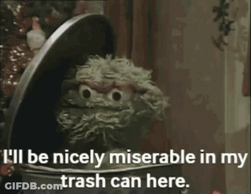Oscar The Grouch From Sesame Street Says " I 'Ll Be Nicely Miserable In My Trash Can Here " GIF