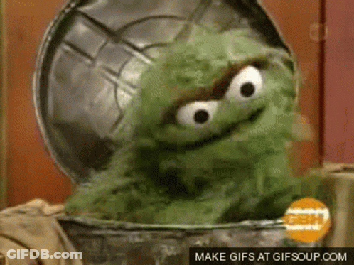 Oscar The Grouch Sitting In Trash Can GIF