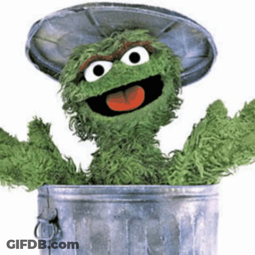Oscar The Grouch Sticking Tongue Out Of Garbage Can GIF