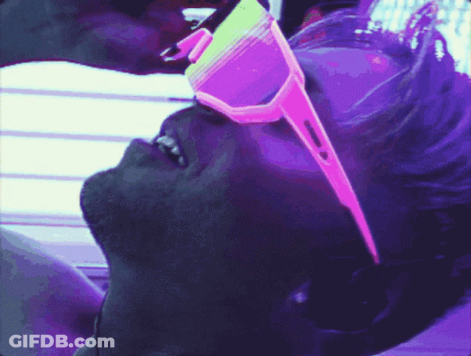 Over Tanning Guy With Shades GIF