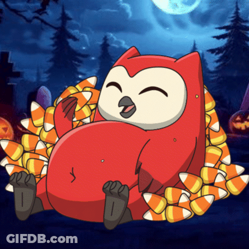 Owl Laying On Pile Of Candy Corn GIF