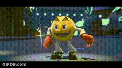 Pac Man Is Wearing Boxing Gloves And Standing On A Stage GIF
