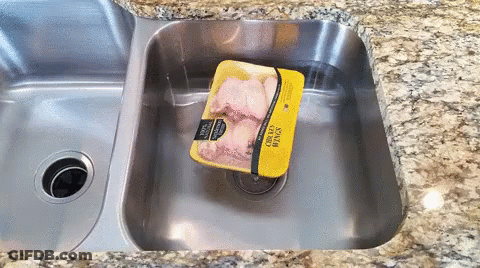 Package Of Chicken Wings In Sink GIF