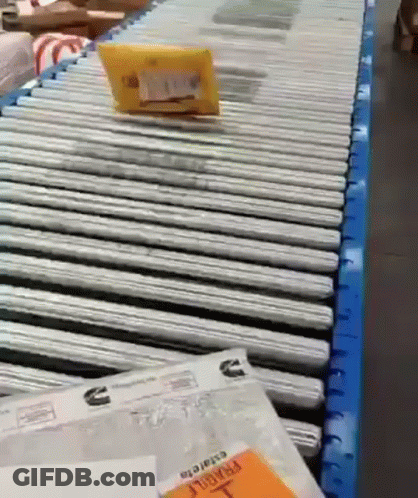 Package On Conveyor Belt Saying Fragile GIF