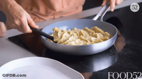 Pan Of Food Cooking On Stove With Number 52 GIF
