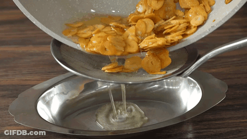 Pan Of Food Poured Into Bowl GIF