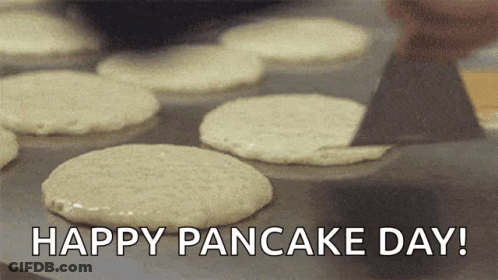 Pan Of Pancakes Saying Happy Pancake Day GIF