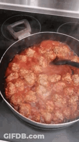 Pan With Meatballs And Tomato Sauce Stirred GIF