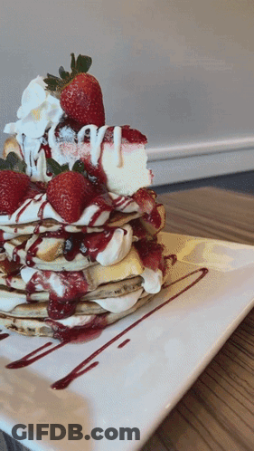 Pancake Stack With Strawberries And Whipped Cream GIF