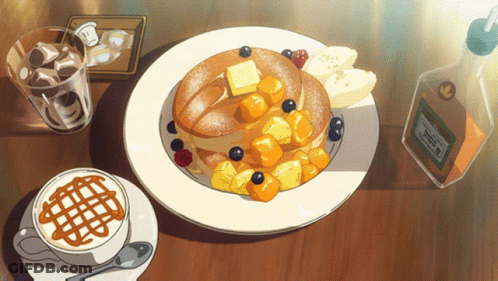 Pancakes With Blueberries And Bananas Next To Coffee And Syrup GIF