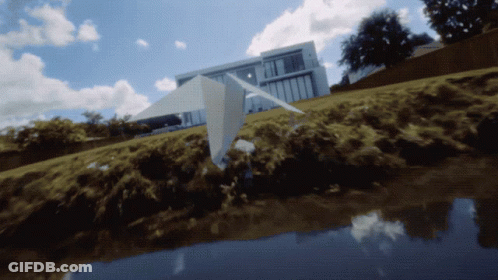 Paper Airplane Flying Over Water GIF