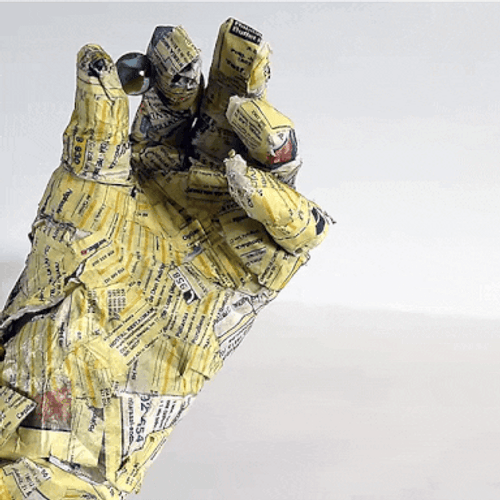 Paper Mache Hand Holding Marble GIF