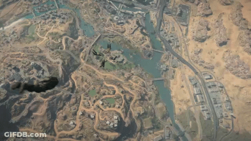 Paratroopers Flying Over City GIF