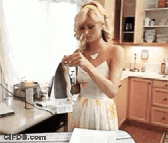 Paris Hilton Playing With Iron GIF