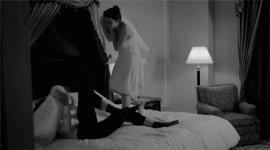Passionate Couple Playful In Bed GIF