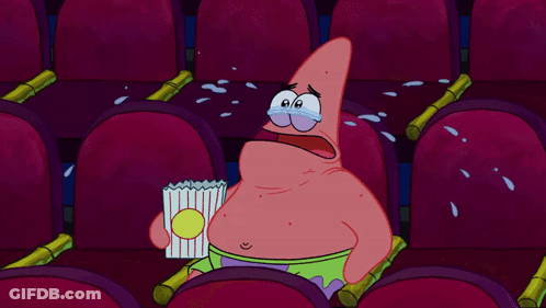 Patrick Star Crying While Holding A Bag Of Popcorn In A Theater GIF