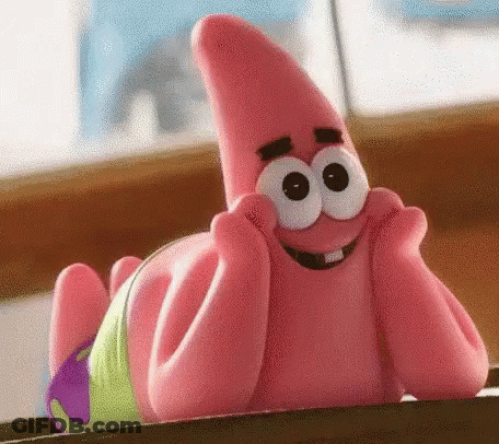 Patrick Star From Spongebob Squarepants Is Laying On A Table With His Hands On His Face And Smiling . GIF