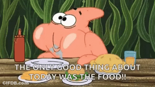 Patrick Star From Spongebob Squarepants Is Sitting At A Table With A Plate Of Food And A Bottle Of Ketchup . GIF