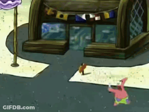 Patrick Star From Spongebob Squarepants Is Standing In Front Of A Building With Flags On It GIF