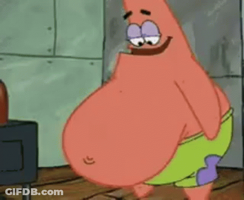 Patrick Star From Spongebob Squarepants Is Standing In Front Of A Stove . GIF