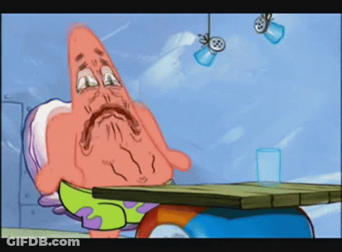 Patrick Star From Spongebob Squarepants Sitting At A Table GIF