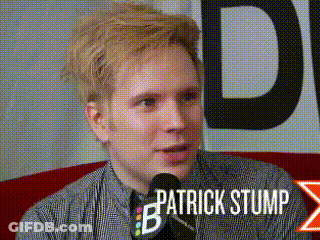 Patrick Stump Sitting At Microphone Talking GIF