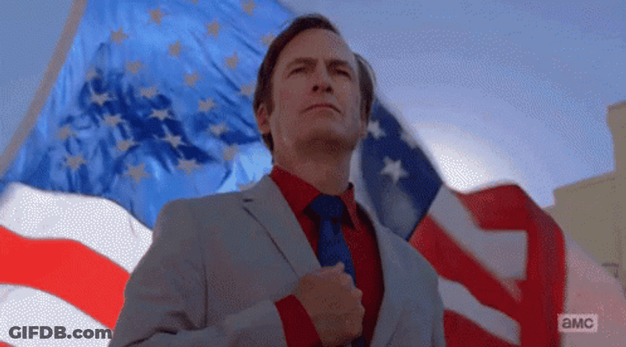 Patriotic Guy And A Waving Flag Behind GIF