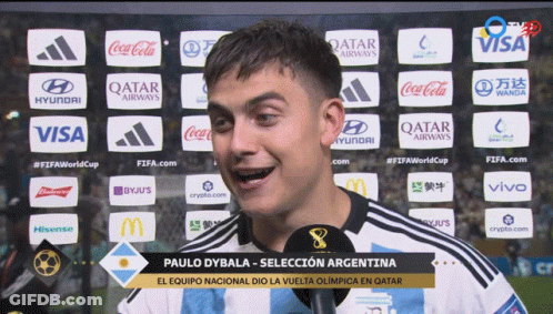 Paulo Dybala Talking Into Microphone In Front Of Qatar Airways Coca Cola Visa Logos GIF