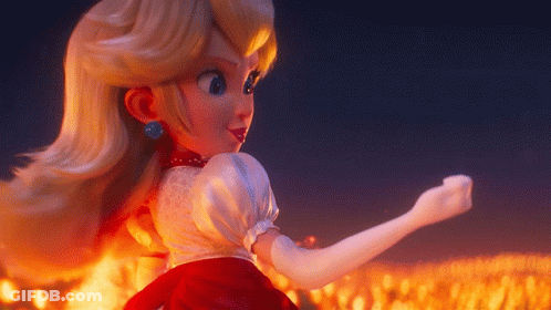Peach Doll Standing In Front Of Flames GIF