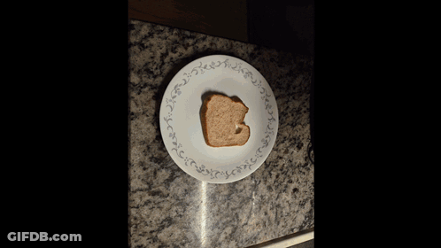 Peanut Butter Bottle Next To Toast And Knife GIF