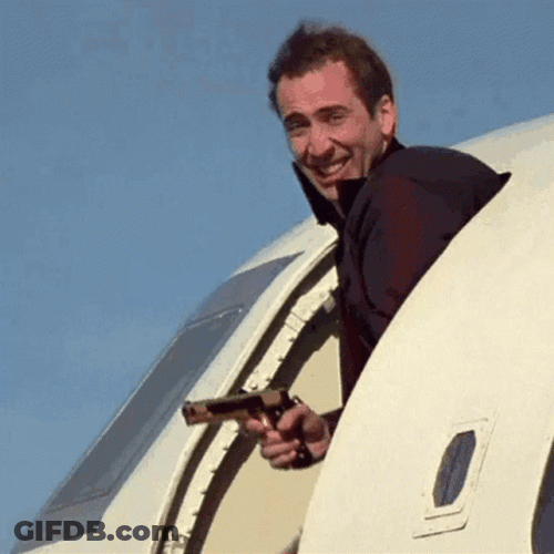 Pedro Pascal Nicolas Cage Holding Gun While In Plane GIF