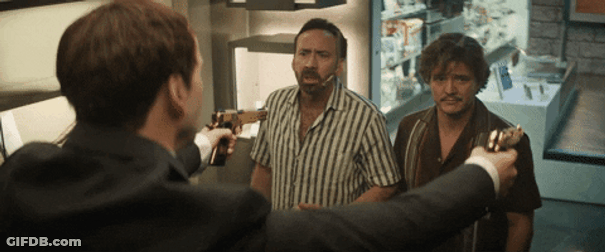 Pedro Pascal Nicolas Cage Two Guns Pointed GIF