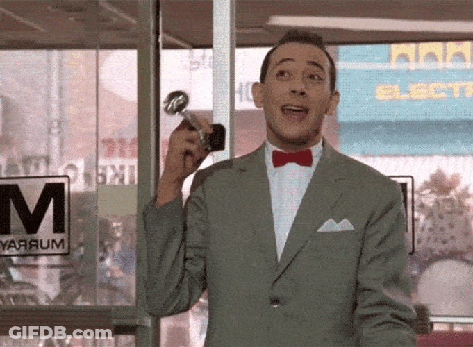 Pee Wee Herman Holding Bicycle Horn GIF