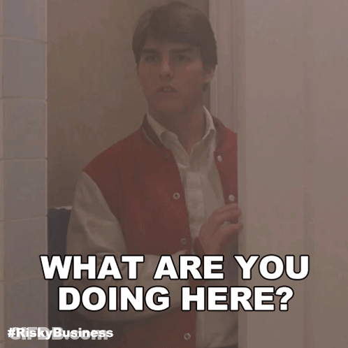 Peeking Red Jacket Man Behind Door What Are You Doing Here GIF
