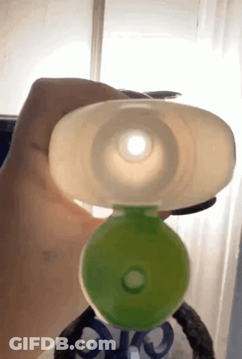 Peeping Inside Lotion Bottle GIF
