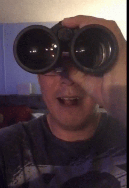 Peeping Tom Licking Lips Watching In Binoculars GIF