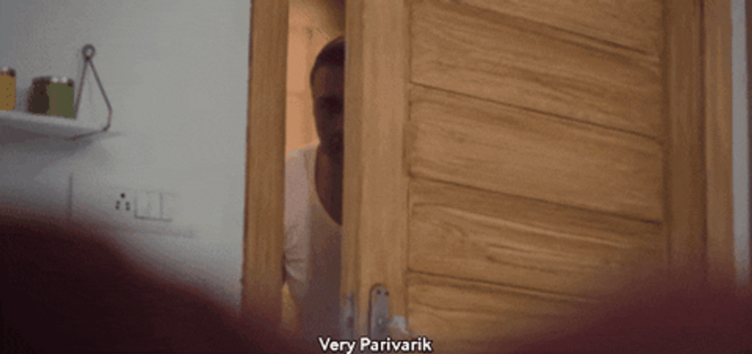Peeping Tom Snooping Behind Door GIF