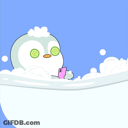 Penguin In Bathtub With Cucumber Slices GIF