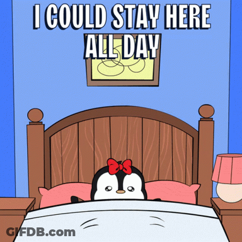Penguin In Bed Saying I Could Stay Here All Day GIF