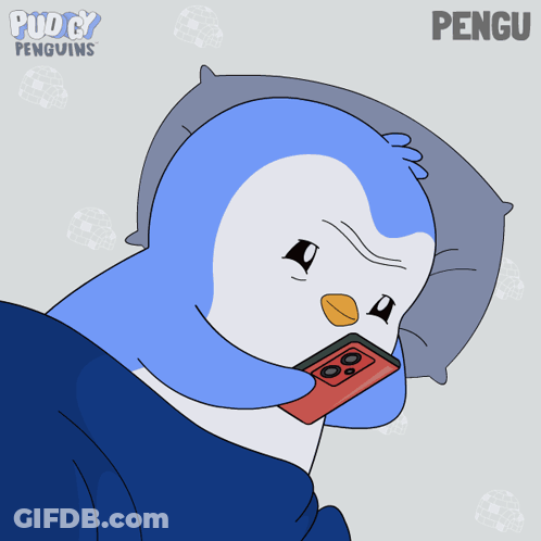 Penguin Lying On Pillow With Hearts GIF