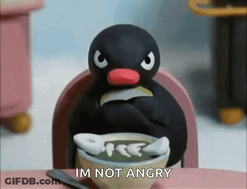 Penguin Sitting At Table Saying Im Not Angry GIF