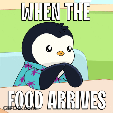 Penguin Sitting At Table When Food Arrives GIF